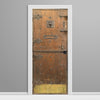 Decorative door with intricate designs on a gray wall