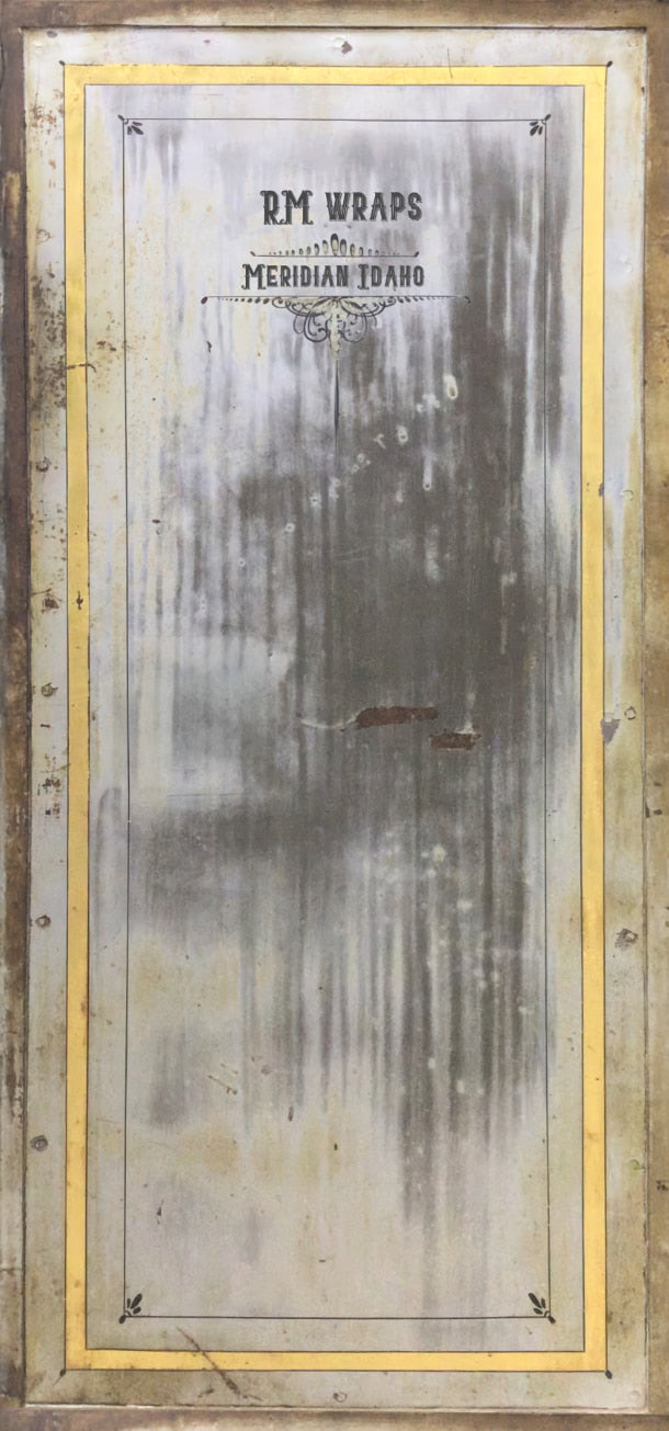 Metal sign with text and a gold border on a wooden background