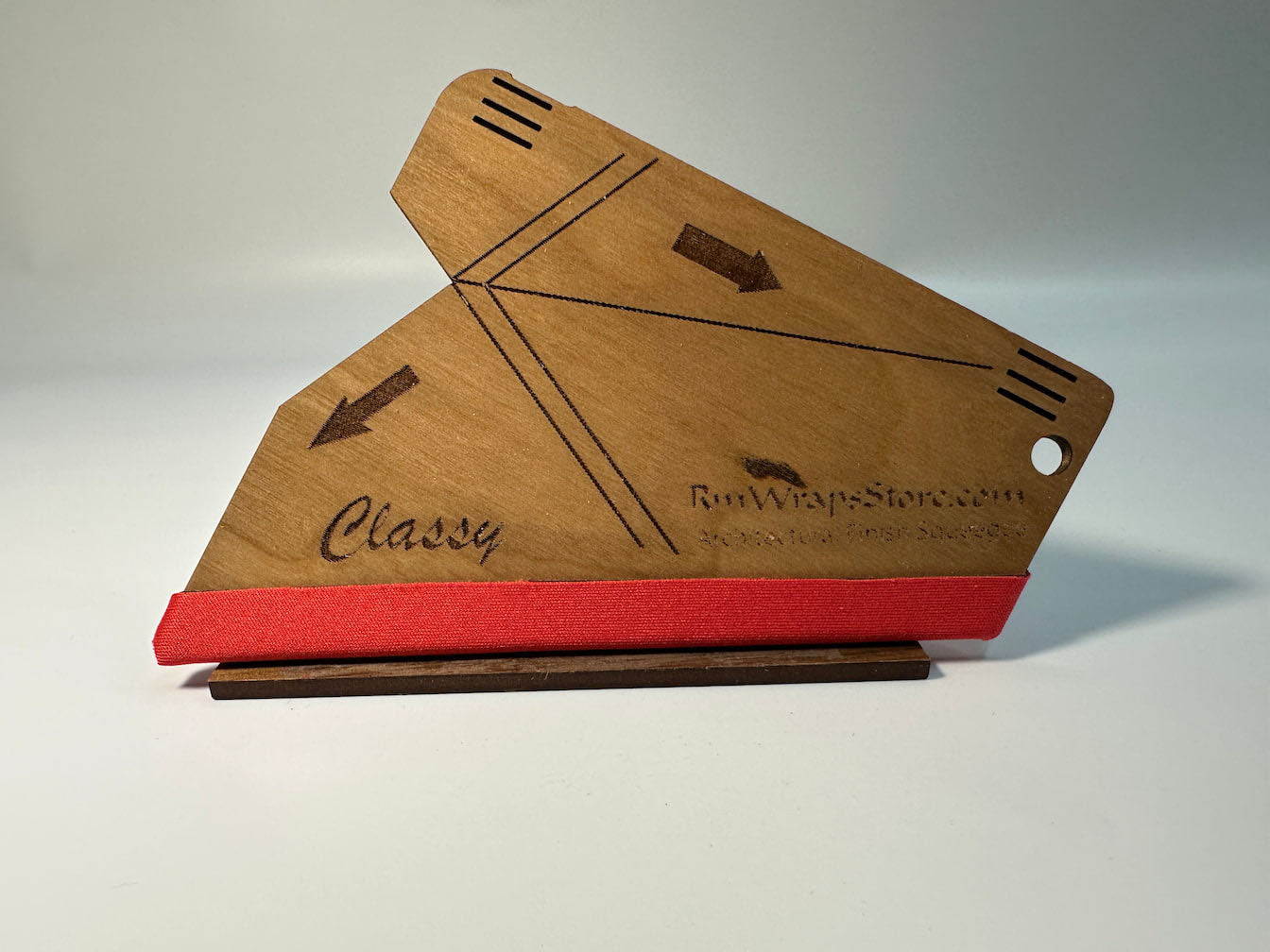 A wooden squeegee with a red microfiber felt surface, featuring guide arrows and a lanyard hole, positioned on a white background.