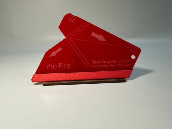Acrylic squeegee with a red microfiber felt surface, featuring guide arrows and a lanyard hole, positioned on a white background.