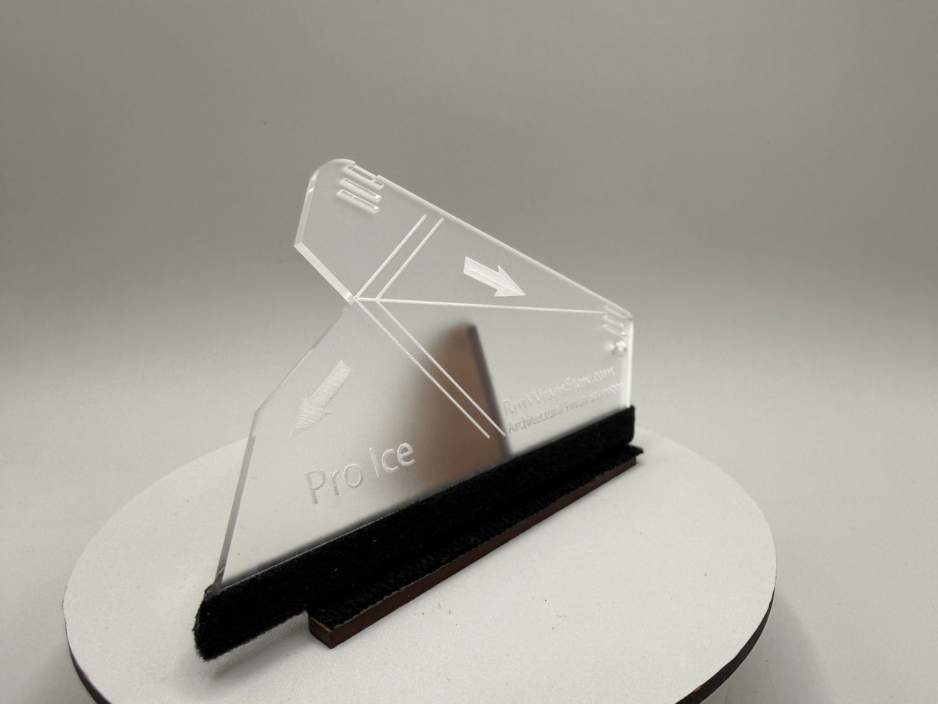 Clear acrylic product display stand with 'ProIce' branding on a gray background