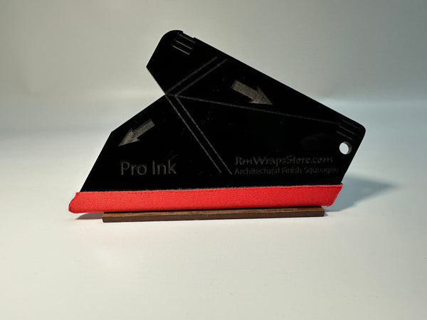 Acrylic Black squeegee with a red microfiber felt surface, featuring guide arrows and a lanyard hole, positioned on a white background.