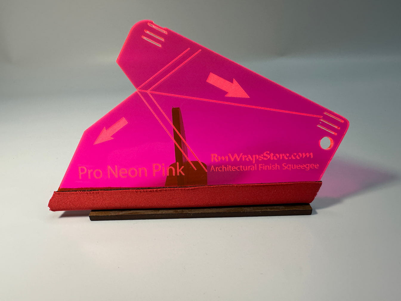 Acrylic squeegee with a red microfiber felt surface, featuring guide arrows and a lanyard hole, positioned on a white background.