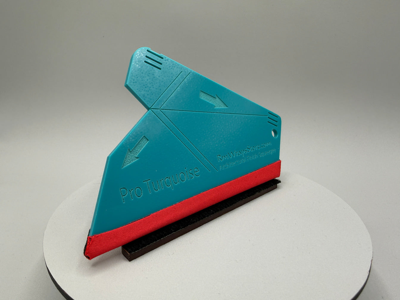 Blue and red squeegee on a gray background