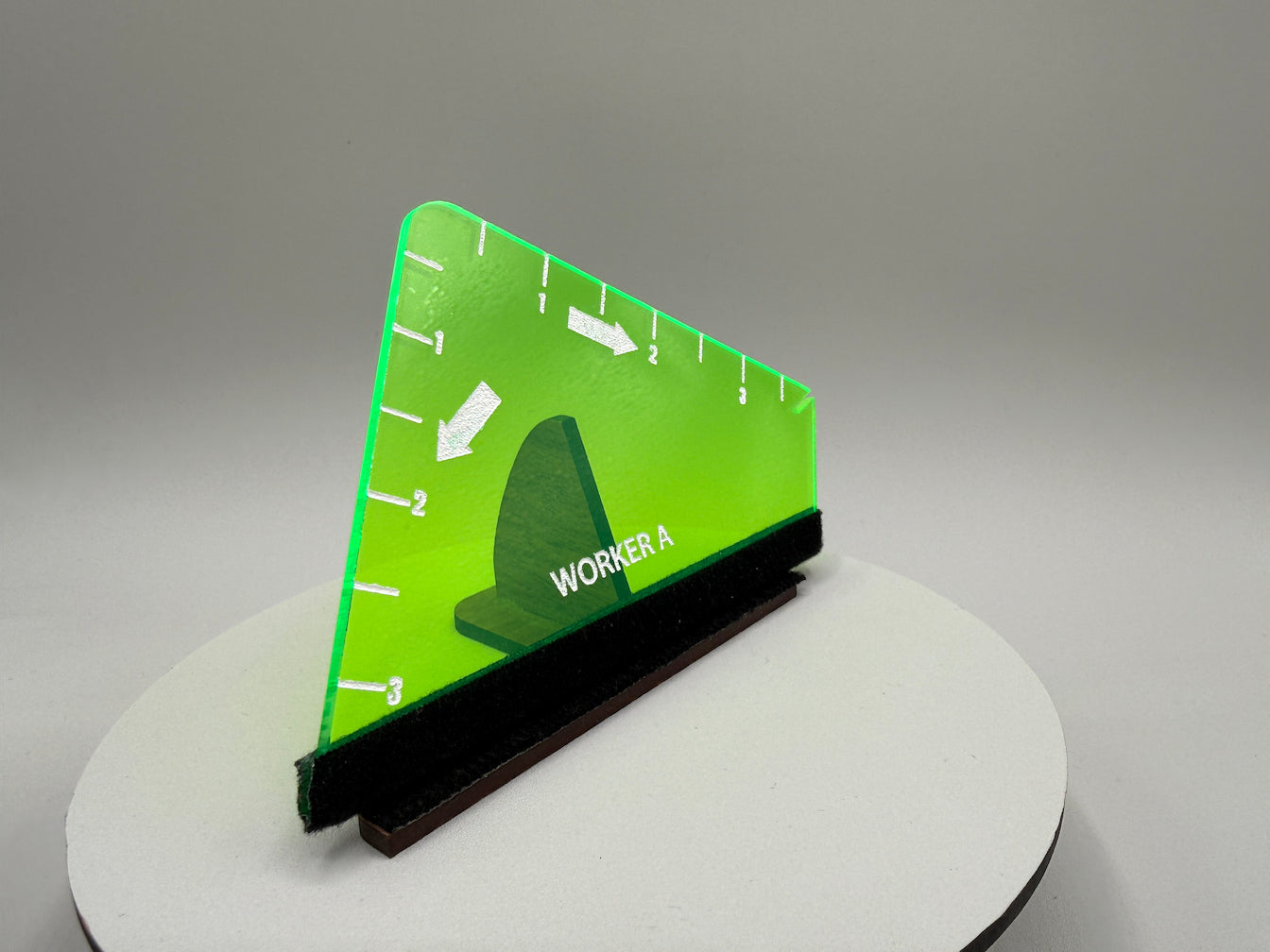 Green and black tool on a gray background