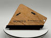Wooden nameplate with 'WORKER B' engraved on a white stand against a gray background