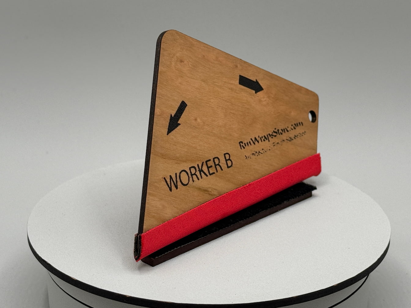 Wooden sign with 'WORKER B' on a white platform
