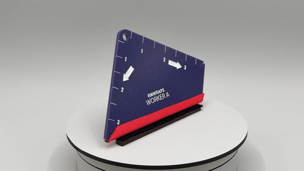 Blue and red tool on a white surface with a gray background