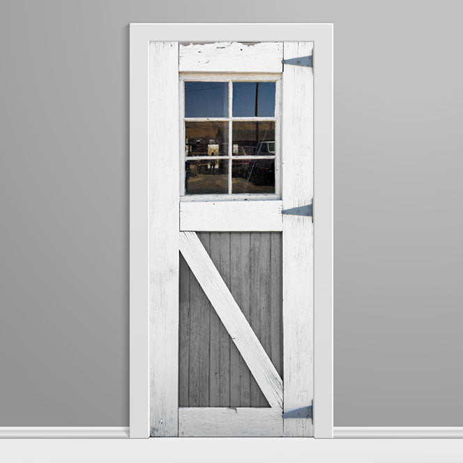 Wooden door with glass panel and white frame on a gray background