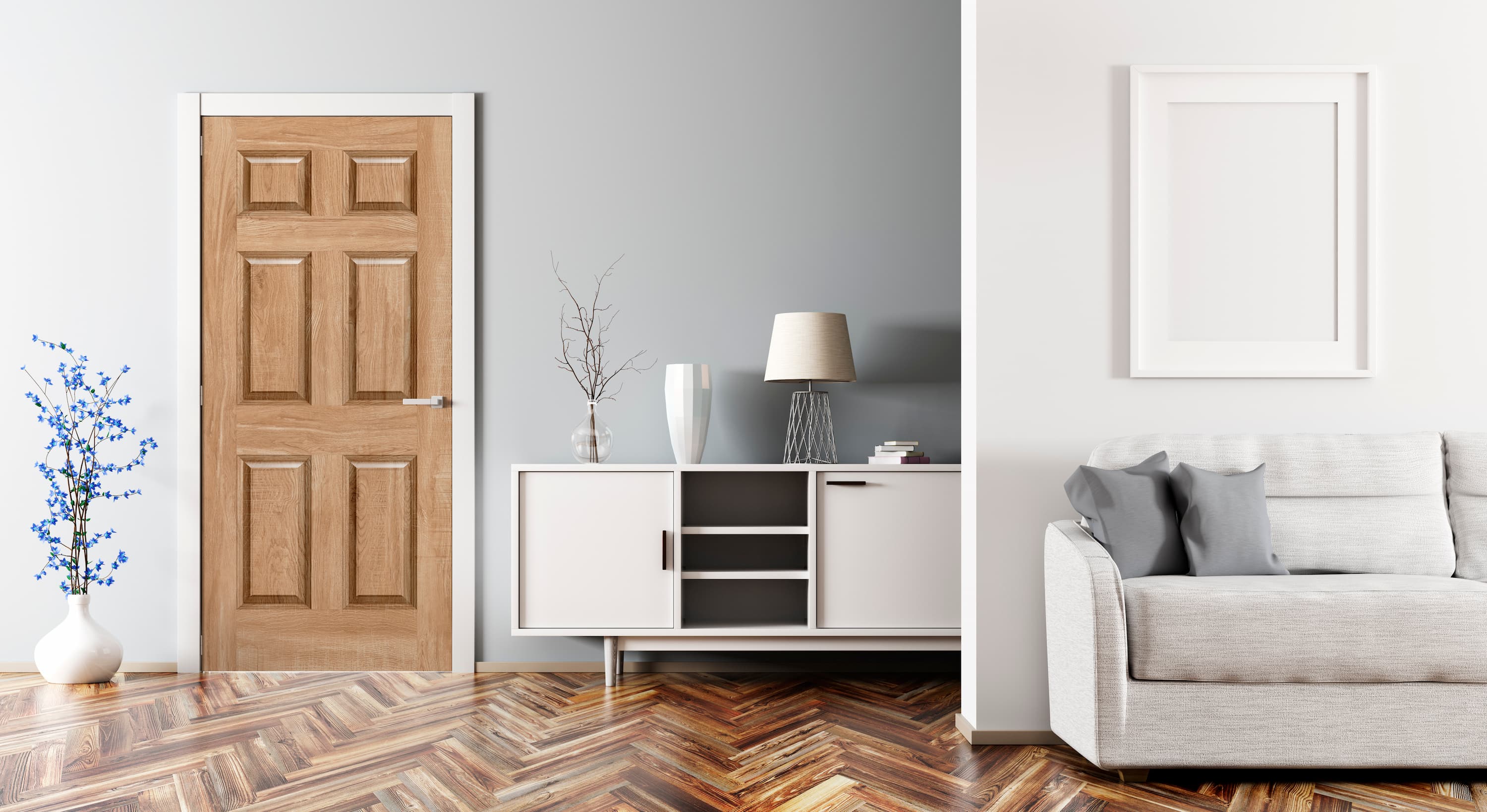 Modern living room with wooden door, white cabinet, and gray sofa.