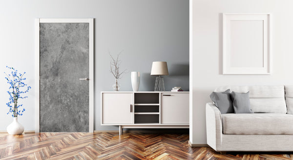 Modern living room with gray sofa, white cabinet, and decorative elements.