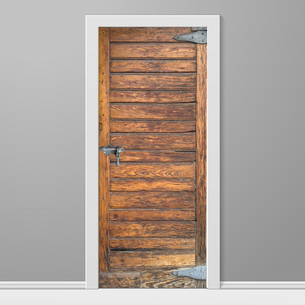Wooden door with metal handles on a gray wall