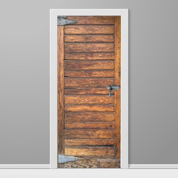 Wooden door with metal handles on a gray wall