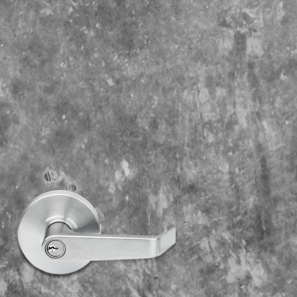 Silver door handle on a textured gray wall