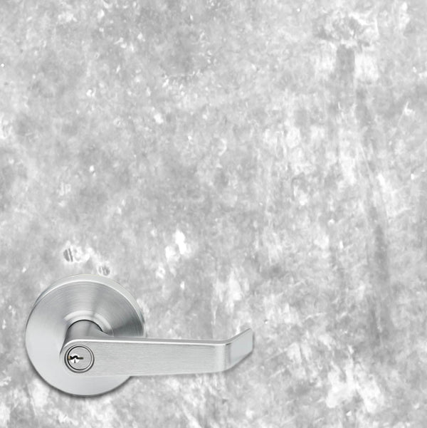 Silver door handle on a textured gray wall